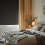 Optimized ME/CFS bedroom setup showing blackout curtains, organized bedside essentials and comfortable rest environment — Healthtokk guide